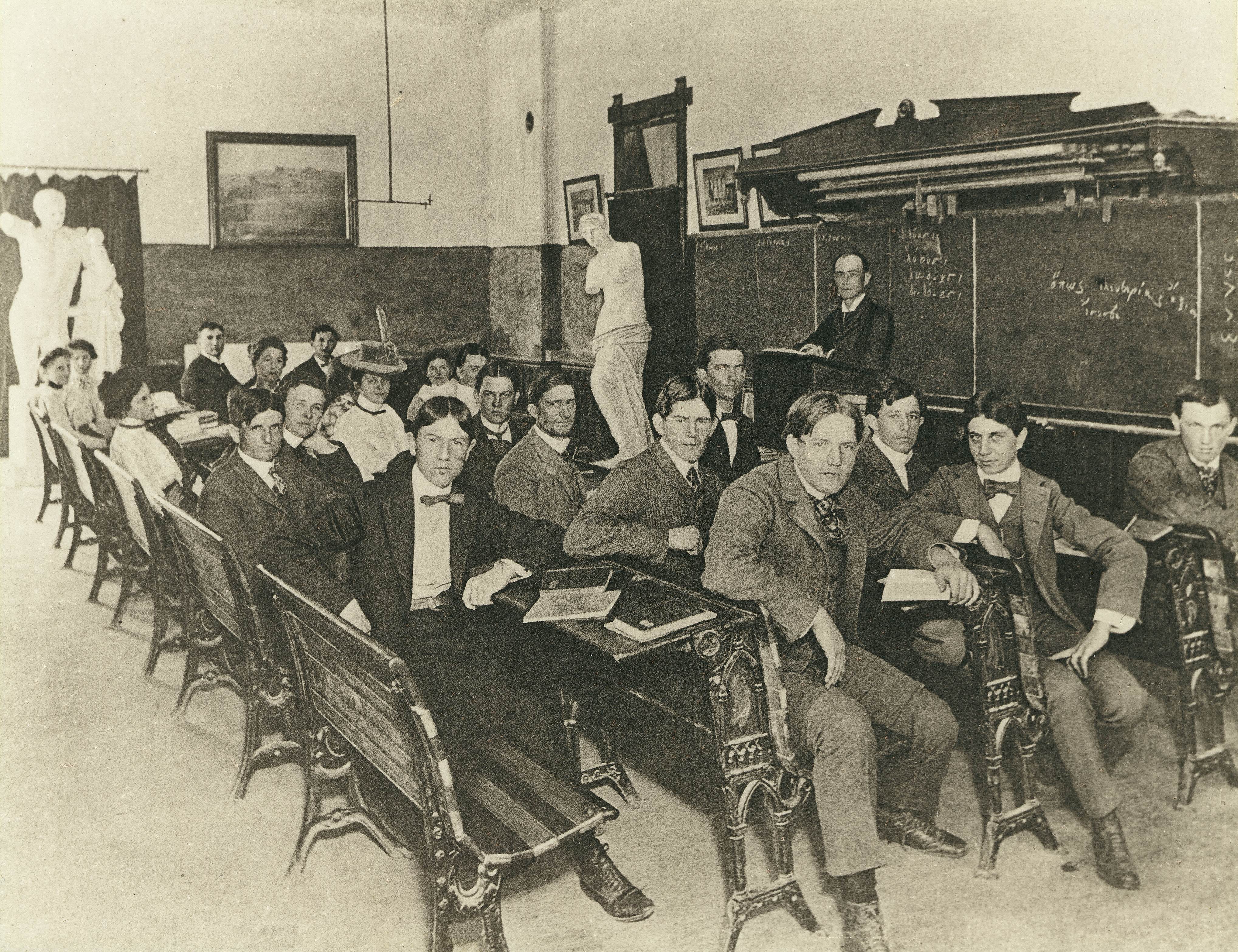 William J. Battle in a classroom with students and some of the casts